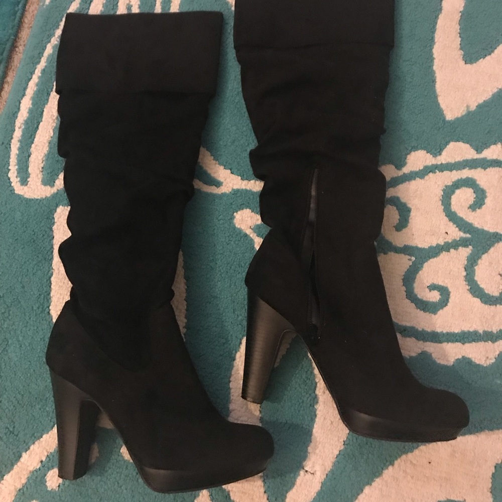 Black high heeled suede boots